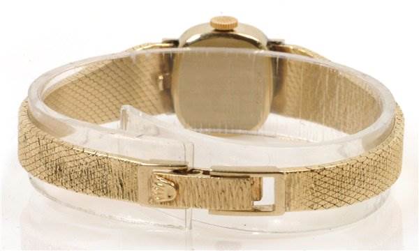 The image shows the back view of a Rolex Cocktail 8370 Women's Yellow Gold Champagne Dial 8370 Women's Yellow Gold Champagne Dial model watch, focusing on the clasp and wristband.