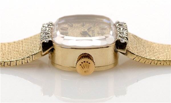 The image shows a side view of a Rolex Cocktail 8370 Women's Yellow Gold Champagne Dial 8370 Women's Yellow Gold Champagne Dial model watch, highlighting the crown, crystal, and bracelet.