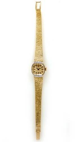 The image shows a top-down view of a Rolex Cocktail 8370 Women's Yellow Gold Champagne Dial 8370 Women's Yellow Gold Champagne Dial model watch, displaying its gold bracelet, dial, and clasp.