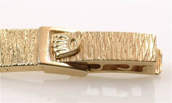 The image shows a close-up of the clasp and part of the bracelet of a Rolex Cocktail 8370 Women's Yellow Gold Champagne Dial 8370 Women's Yellow Gold Champagne Dial model watch.