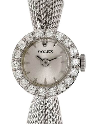 This image shows a front view of a Rolex Cocktail Women's White Gold Silver Dial Women's White Gold Silver Dial watch, highlighting its round dial, diamond bezel, crown, and mesh bracelet.