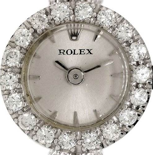 This image shows a close-up, front-facing angle of the dial and diamond-encrusted bezel of a Rolex Cocktail Women's White Gold Silver Dial Women's White Gold Silver Dial model watch.