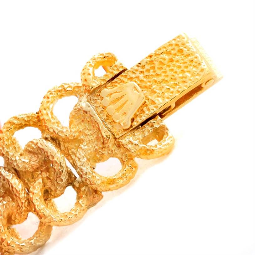 This image shows a close-up of the clasp and part of the bracelet of a Rolex Cocktail 8312 Women's Yellow Gold Champagne Dial 8312 Women's Yellow Gold Champagne Dial model watch.
