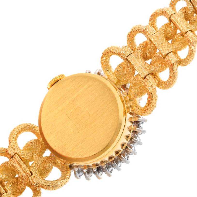 This image shows the back case and partial bracelet of the Cocktail model by Rolex.