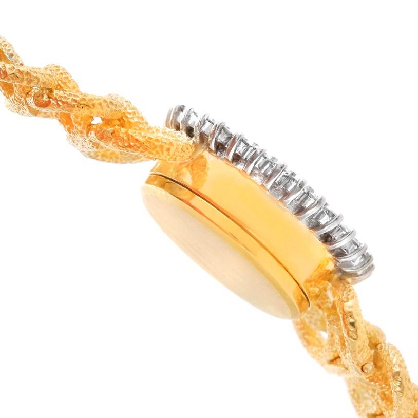 This image shows a side angle of the case and band of the Rolex Cocktail 8312 Women's Yellow Gold Champagne Dial 8312 Women's Yellow Gold Champagne Dial model watch, highlighting its intricate bracelet and polished edges.