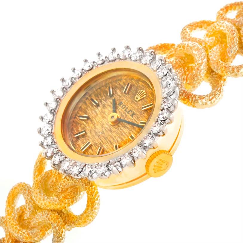 This image shows a close-up view of the face, bezel, and strap of a Rolex Cocktail 8312 Women's Yellow Gold Champagne Dial 8312 Women's Yellow Gold Champagne Dial model watch.
