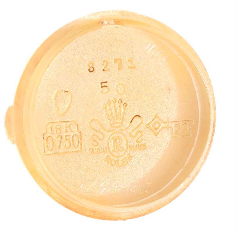 The image shows the inside case back of a Rolex Cocktail 8271 Women's Yellow Gold Silver Dial 8271 Women's Yellow Gold Silver Dial model watch, highlighting the 18K gold hallmark and Rolex engravings.