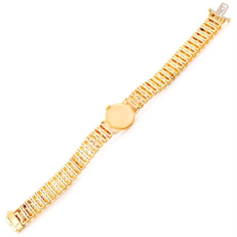The image shows a top-down view of a Rolex Cocktail 8271 Women's Yellow Gold Silver Dial 8271 Women's Yellow Gold Silver Dial model watch, displaying its gold bracelet and round dial.