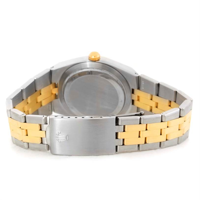 The image shows the back case and clasp of the Vintage Collection model by Rolex, highlighting its two-tone metal bracelet.