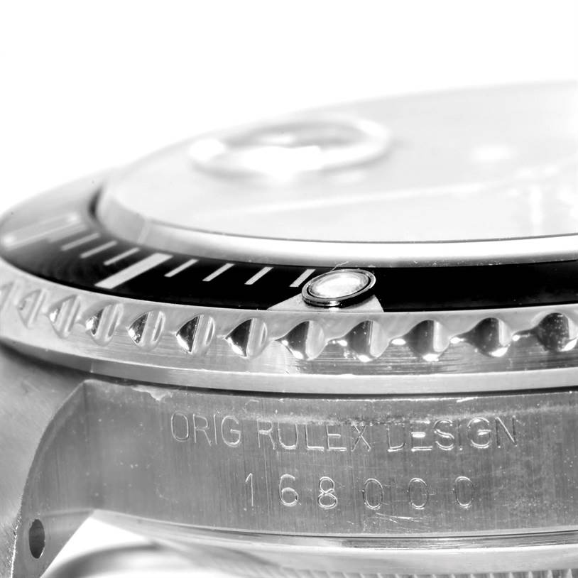 The image shows a close-up of the bezel and casing of a Vintage Collection model by Rolex, highlighting the model number 168000.