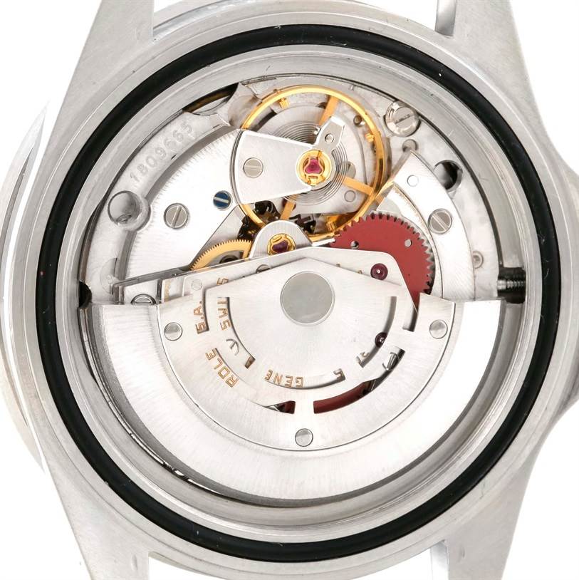 The image shows a close-up view of the internal mechanism and gears of a Rolex Vintage Collection 168000 Men's Stainless Steel Black Dial 168000 Men's Stainless Steel Black Dial watch.