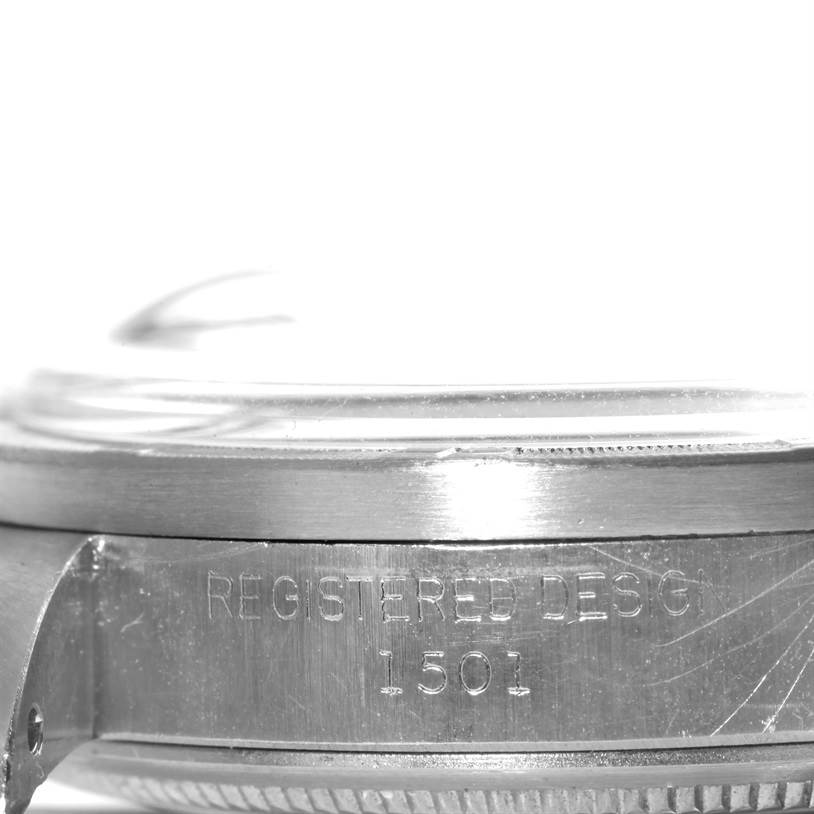 This close-up side angle of the Rolex Vintage Collection 1501 Men's Stainless Steel Silver Dial 1501 Men's Stainless Steel Silver Dial model shows the bezel and the case with the engraved design number 1501.