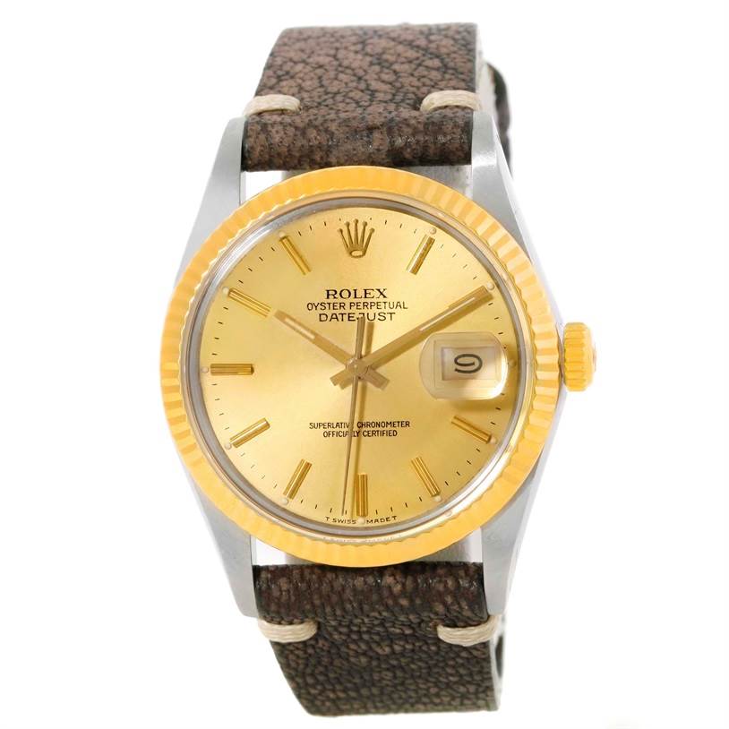 The image shows a front view of a Rolex Vintage Collection 16013 Men's Stainless Steel Champagne Dial 16013 Men's Stainless Steel Champagne Dial Oyster Perpetual Datejust watch with a brown leather strap and gold dial.