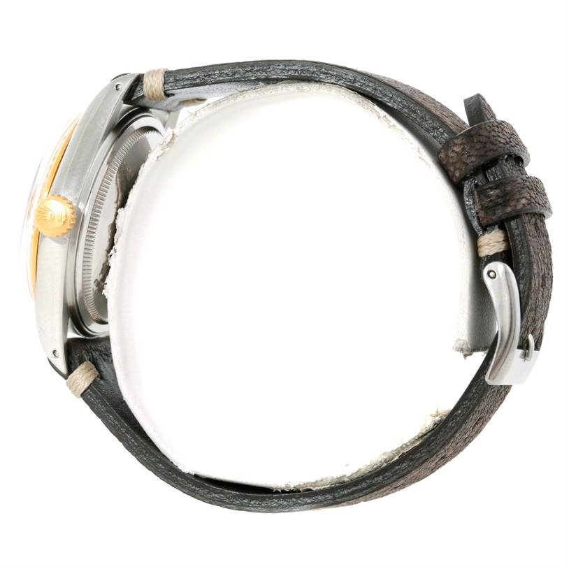 The image shows a side view of a Vintage Collection Rolex watch, highlighting its crown, bezel, and leather strap with buckle.