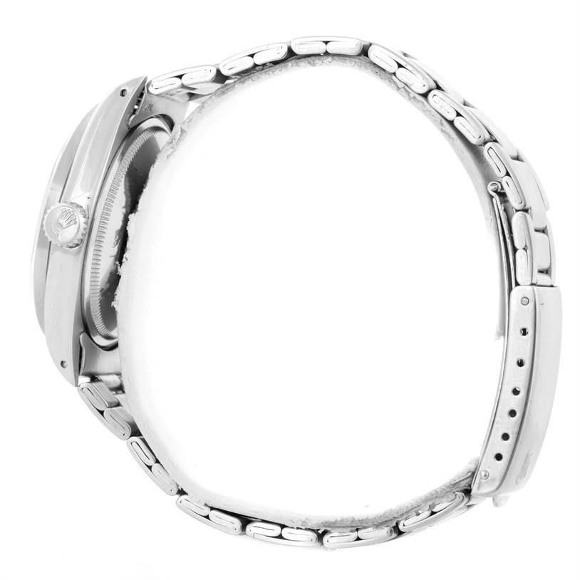 The image shows a side view of a Rolex Vintage Collection 1501 Men's Stainless Steel Silver Dial 1501 Men's Stainless Steel Silver Dial watch, focusing on the crown, case, and bracelet.