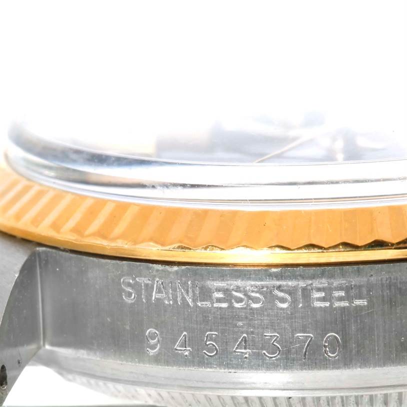 This close-up image shows the side of a Rolex Vintage Collection 16013 Men's Stainless Steel Blue Dial 16013 Men's Stainless Steel Blue Dial watch, highlighting the stainless steel case and part of the bezel.