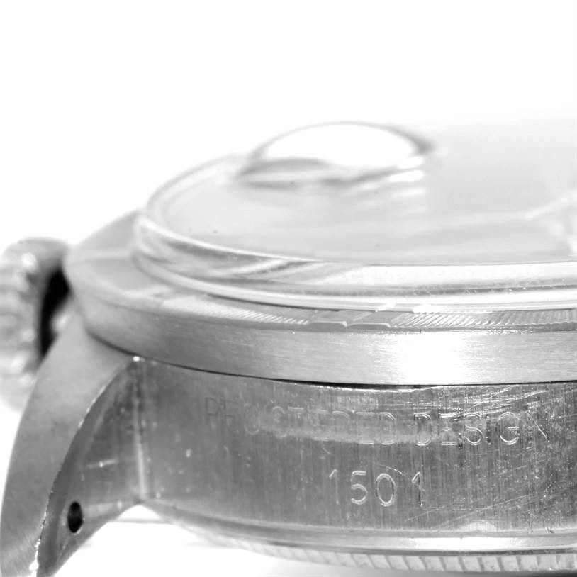 This image shows a close-up side view of the Rolex Vintage Collection 1501 Men's Stainless Steel Blue Dial 1501 Men's Stainless Steel Blue Dial watch, highlighting the case and part of the crown.