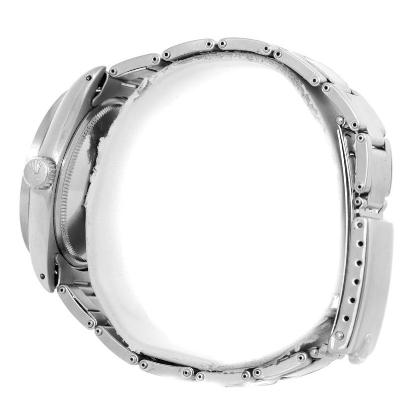 The image shows a side view of a Rolex Vintage Collection 1501 Men's Stainless Steel Blue Dial 1501 Men's Stainless Steel Blue Dial model watch, focusing on its case and metal bracelet.