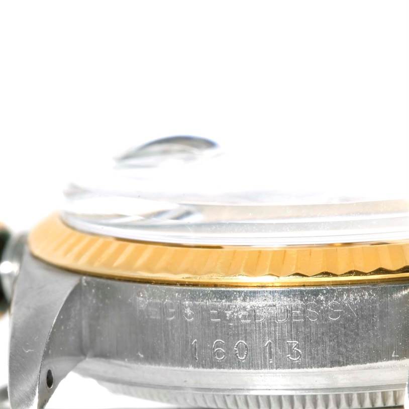 This image shows a close-up side view of the bezel and case of the Rolex Vintage Collection 16013 Men's Stainless Steel Champagne Dial 16013 Men's Stainless Steel Champagne Dial model 16013.