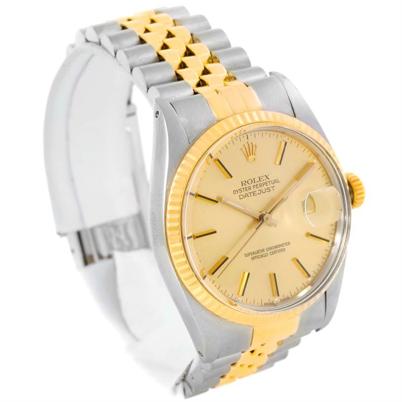 This image shows a side angle of the Rolex Vintage Collection 16013 Men's Stainless Steel Champagne Dial 16013 Men's Stainless Steel Champagne Dial Datejust watch, highlighting the two-tone bracelet and the gold dial.