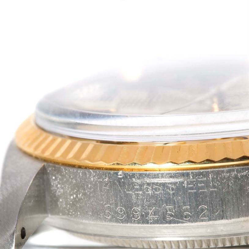 The image shows a close-up side view of the case and bezel of a Vintage Collection model by Rolex.