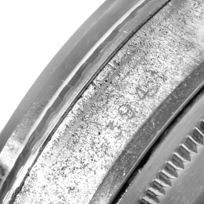 Close-up of the side of the Rolex Vintage Collection 1603 Men's Stainless Steel Blue Dial 1603 Men's Stainless Steel Blue Dial watch, showing part of the case and bezel.