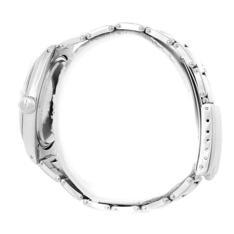 This side view of the Rolex Vintage Collection 1500 Men's Stainless Steel Silver Dial 1500 Men's Stainless Steel Silver Dial model shows the watch case, crown, and bracelet.