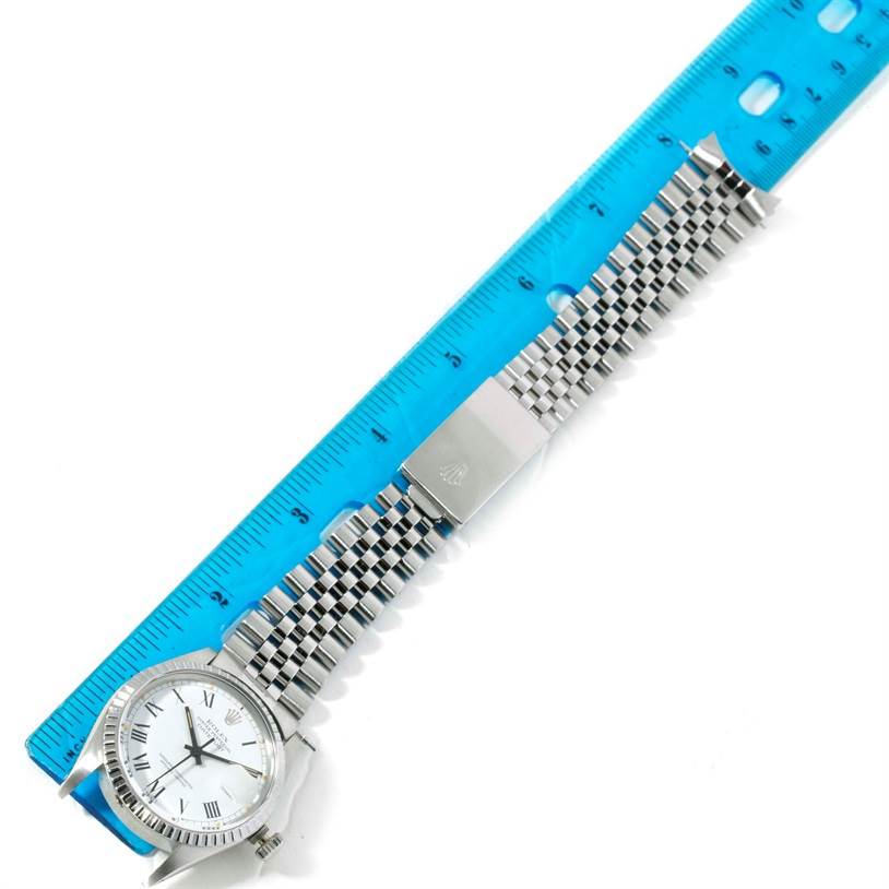 The image shows a Rolex Vintage Collection 16030 Men's Stainless Steel White Dial 16030 Men's Stainless Steel White Dial watch with a stainless steel bracelet, displayed alongside a blue ruler for scale.