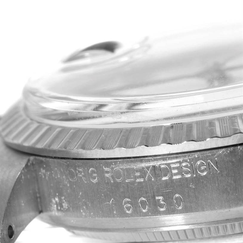 This close-up image of the Vintage Collection model by Rolex shows the side of the watch case, bezel, and part of the crystal.