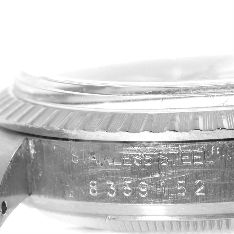 The image shows a close-up side view of the bezel and case with serial numbers of a Vintage Collection model by Rolex.