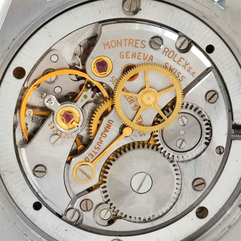 This image shows an internal view of the Rolex Vintage Collection 6694 Men's Stainless Steel Black Dial 6694 Men's Stainless Steel Black Dial watch, focusing on its intricate gears and mechanical components.