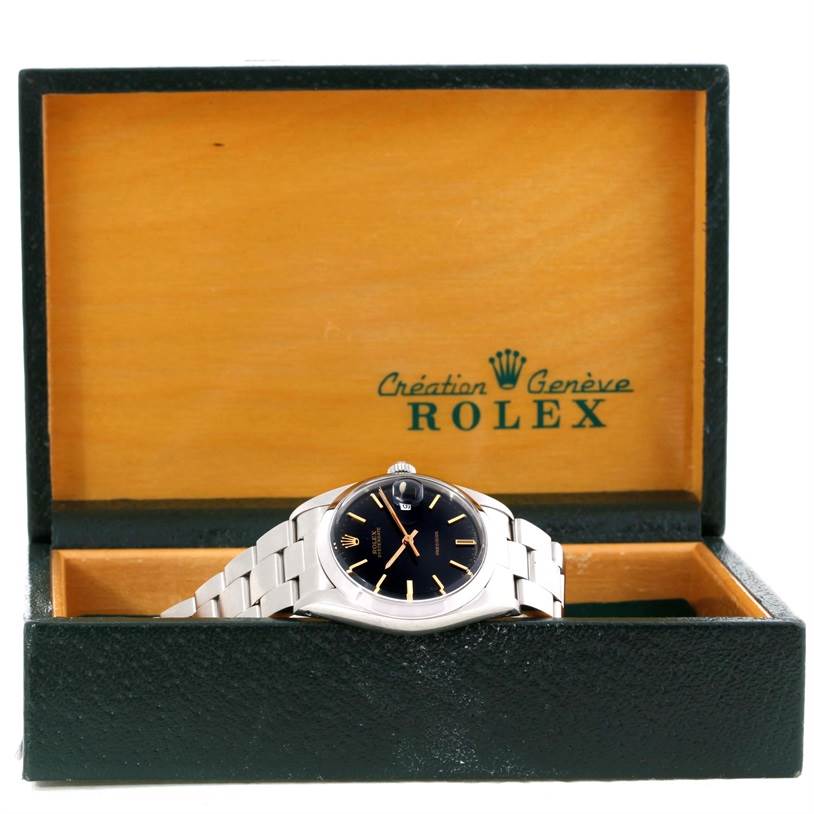 The image shows a Rolex Vintage Collection 6694 Men's Stainless Steel Black Dial 6694 Men's Stainless Steel Black Dial watch placed inside an open watch box, viewed from the front.