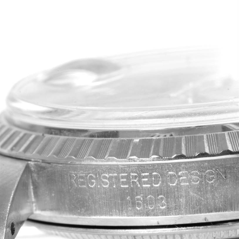 The image shows a close-up angle of the side of a Vintage Collection Rolex watch, focusing on the bezel and case with the "REGISTERED DESIGN 1603" engraving.