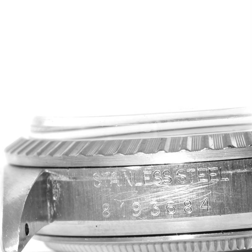 This image shows a close-up view of the side of a Rolex Vintage Collection 16030 Men's Stainless Steel Blue Dial 16030 Men's Stainless Steel Blue Dial watch, highlighting its stainless steel case and partial serial number.