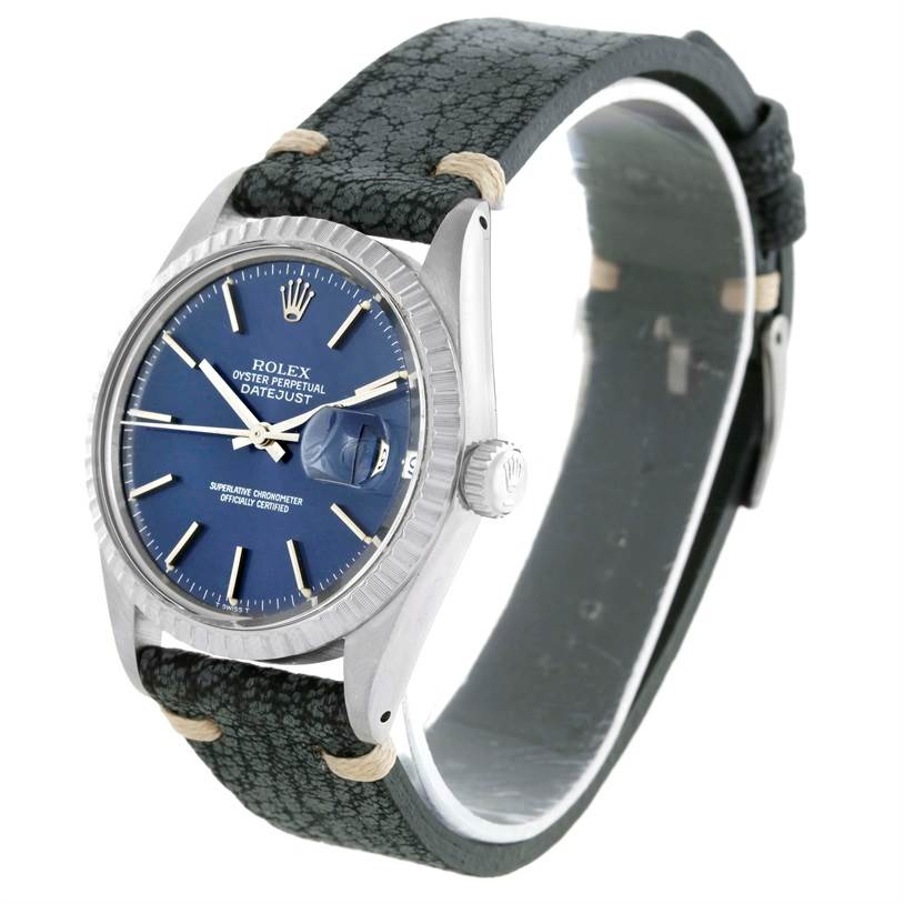 The image shows a Rolex Vintage Collection 16030 Men's Stainless Steel Blue Dial 16030 Men's Stainless Steel Blue Dial Oyster Perpetual Datejust with a blue dial, silver case, and textured black strap from an angled view.
