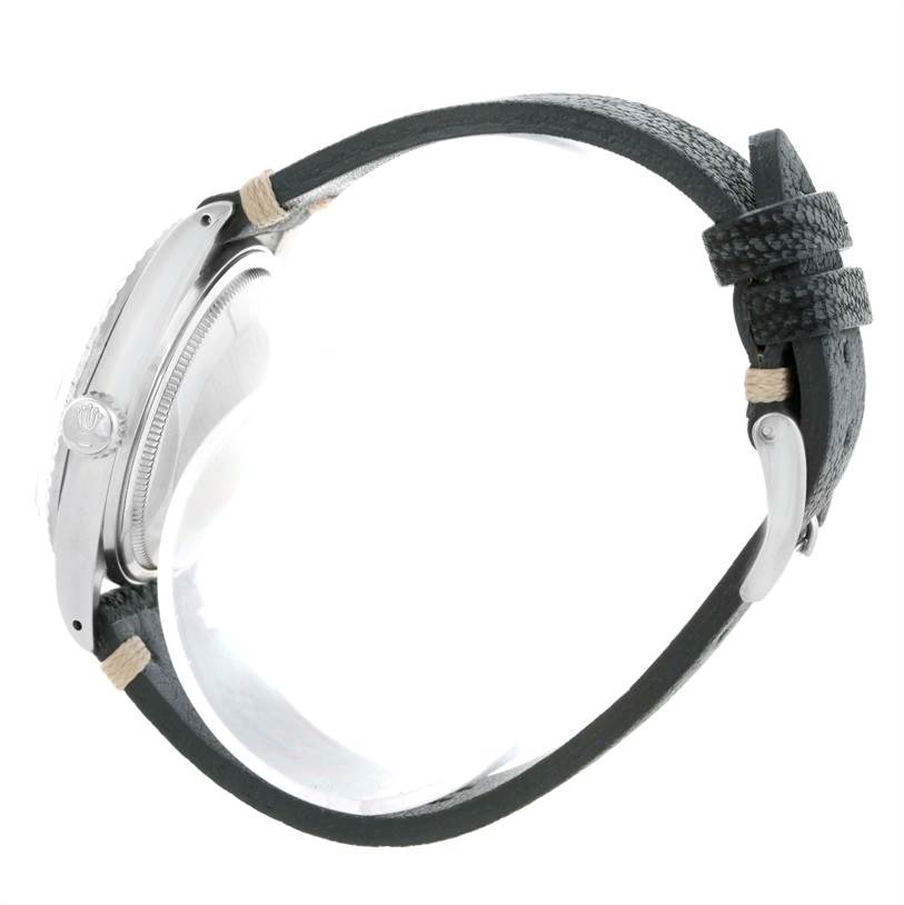 This image shows a side view of a Rolex Vintage Collection 16030 Men's Stainless Steel Blue Dial 16030 Men's Stainless Steel Blue Dial watch featuring the crown and black leather strap.