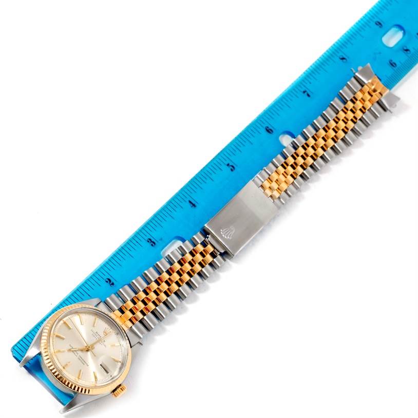 The image shows a Rolex Vintage Collection 1601 Men's Stainless Steel Silver Dial 1601 Men's Stainless Steel Silver Dial watch, including its face, bracelet, and clasp, laid flat beside a ruler.