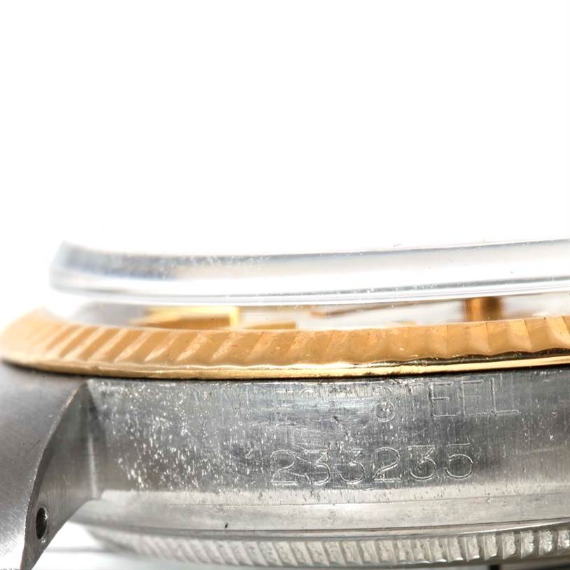 This image shows a close-up side view of the bezel and case with engraved serial number from the Vintage Collection model by Rolex.