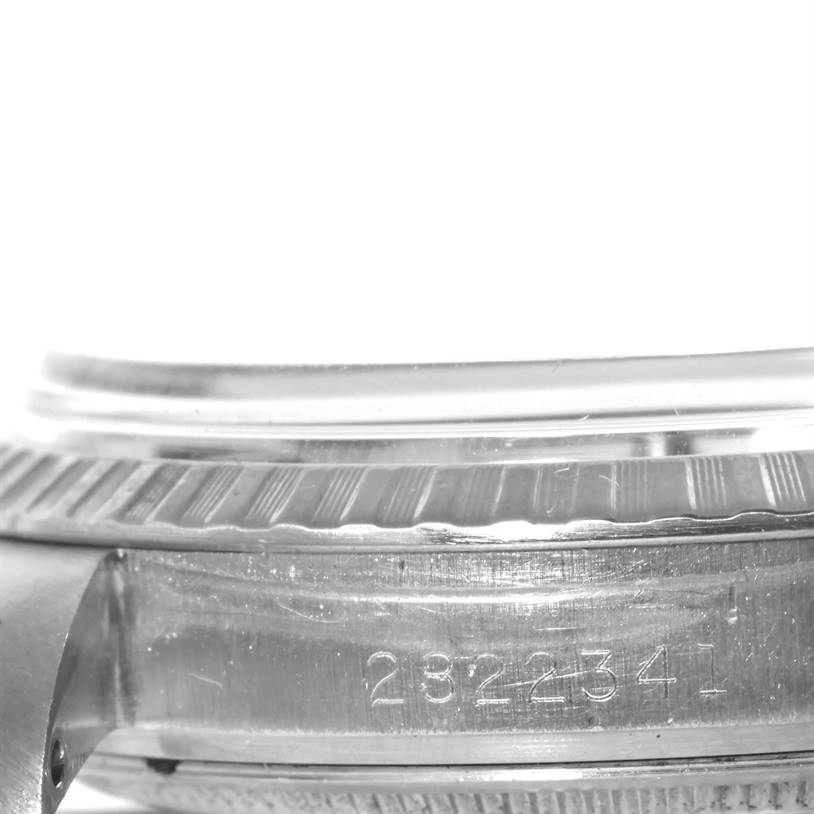 This close-up image shows the side view of the case and part of the bezel of the Rolex Vintage Collection 1603 Men's Stainless Steel Silver Dial 1603 Men's Stainless Steel Silver Dial model, including its serial number.