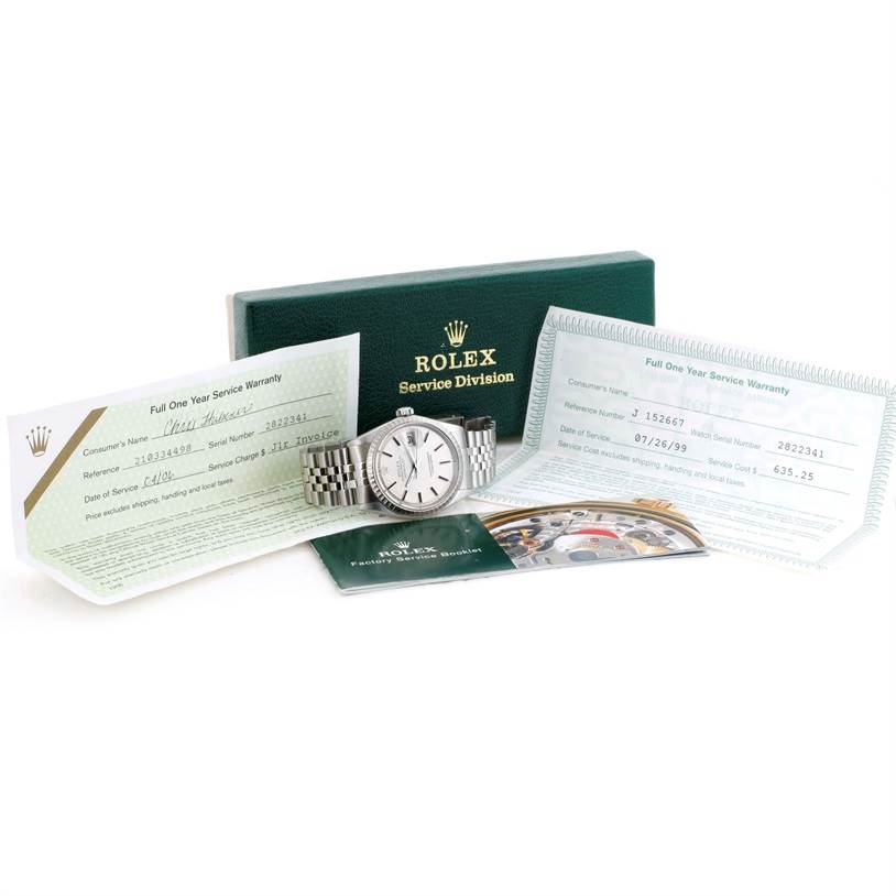 The image shows a Vintage Collection Rolex watch at a front angle, accompanied by warranty cards, a service booklet, and a green Rolex case.