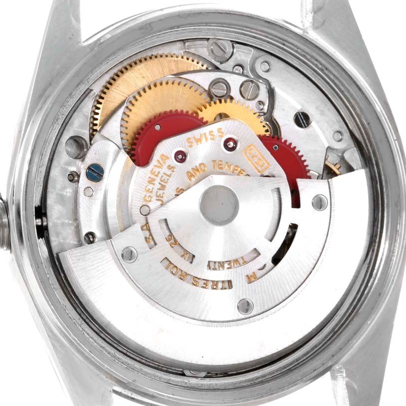 The image shows the intricate internal mechanism of a Vintage Collection Rolex watch from the back.