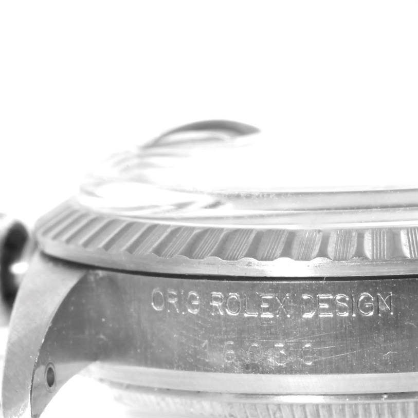 The image shows a side-angle view of the Rolex Vintage Collection 16030 Men's Stainless Steel Silver Dial 16030 Men's Stainless Steel Silver Dial watch, highlighting the bezel and engraved serial number.