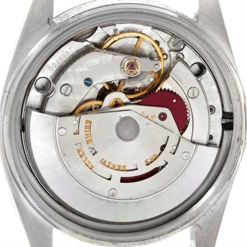 This is a close-up of the internal mechanical movement of a Rolex Vintage Collection 16013 Men's Stainless Steel Silver Dial 16013 Men's Stainless Steel Silver Dial watch, showing gears and components.