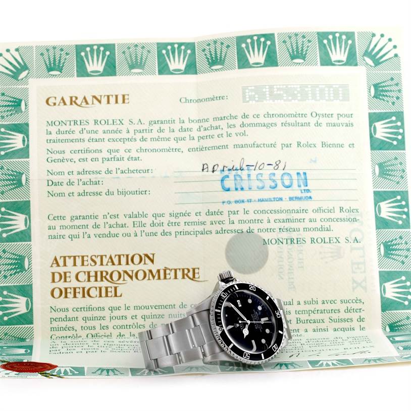 The Rolex Vintage Collection 1665 Men's Stainless Steel Black Dial 1665 Men's Stainless Steel Black Dial watch is shown placed at an angle atop its guarantee certificate.