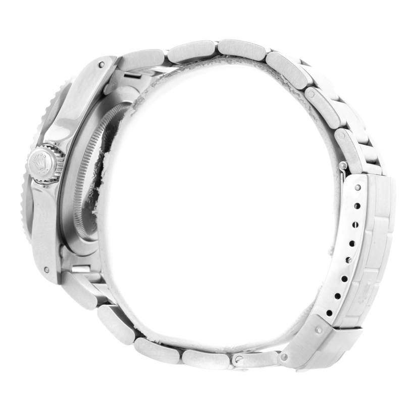 The image shows a side profile of the Rolex Vintage Collection 1665 Men's Stainless Steel Black Dial 1665 Men's Stainless Steel Black Dial watch, highlighting the crown, case side, and metal bracelet.