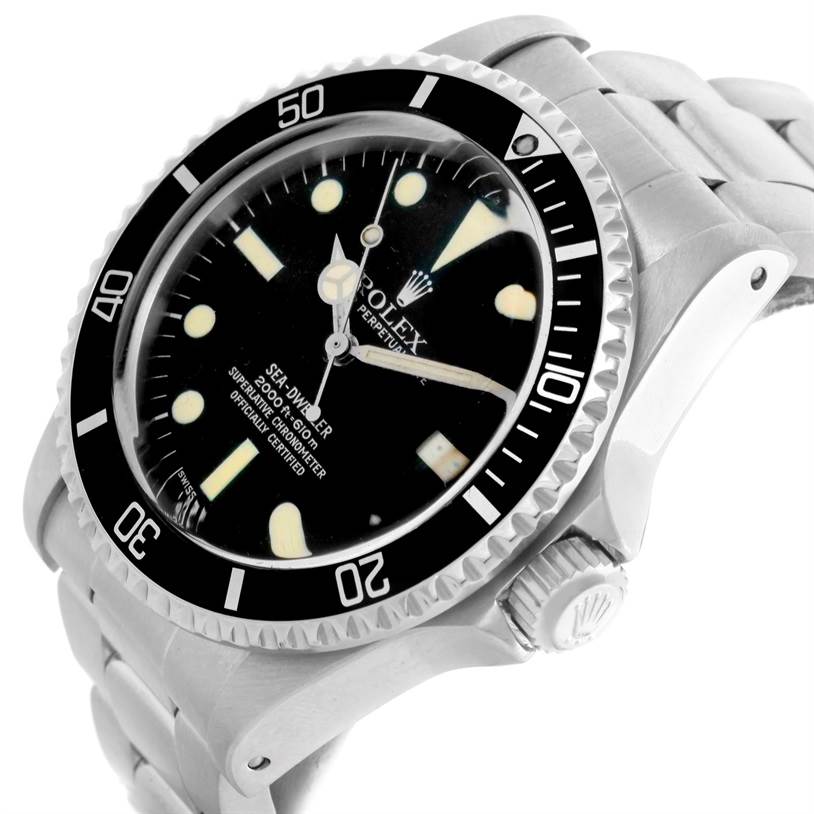 This image shows a Rolex Vintage Collection 1665 Men's Stainless Steel Black Dial 1665 Men's Stainless Steel Black Dial watch at an angled close-up, highlighting the face, bezel, crown, and part of the metal band.
