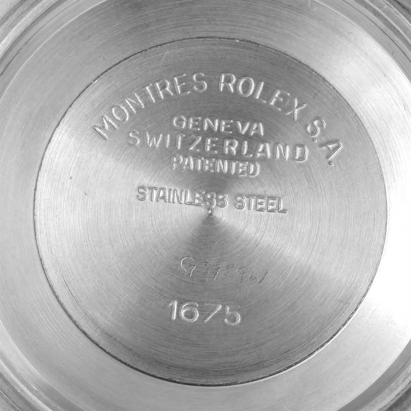 The image shows the back case of a Rolex Vintage Collection 1675 Men's Stainless Steel Black Dial 1675 Men's Stainless Steel Black Dial model 1675, highlighting the "Montres Rolex S.A." engraving.