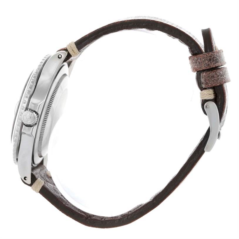 The image shows a side view of a Rolex Vintage Collection 1675 Men's Stainless Steel Black Dial 1675 Men's Stainless Steel Black Dial model watch, highlighting its crown and leather strap.