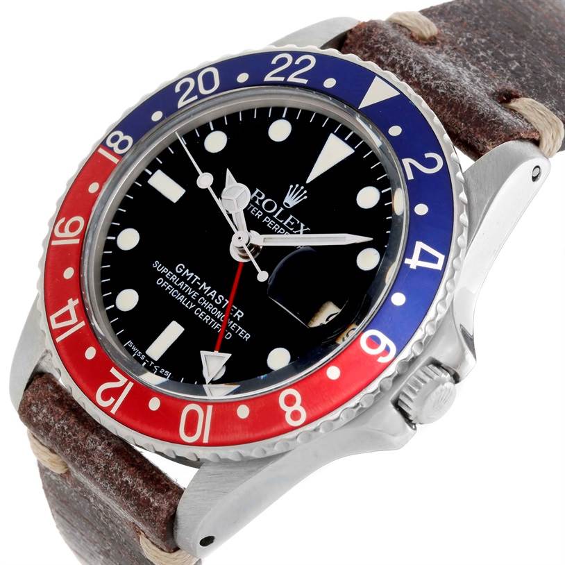 The Rolex Vintage Collection 1675 Men's Stainless Steel Black Dial 1675 Men's Stainless Steel Black Dial GMT-Master watch is shown from a front-left angle, displaying its bezel, dial, and part of its leather strap.