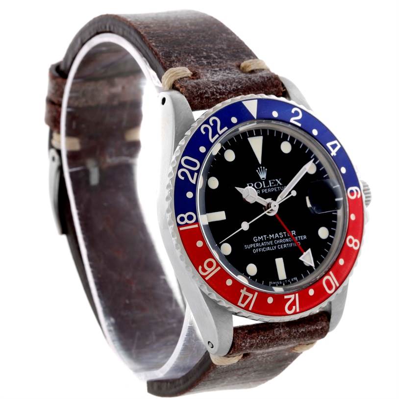 The Rolex Vintage Collection 1675 Men's Stainless Steel Black Dial 1675 Men's Stainless Steel Black Dial GMT-Master watch is shown at a front angle, highlighting its dial, bezel, and brown leather strap.